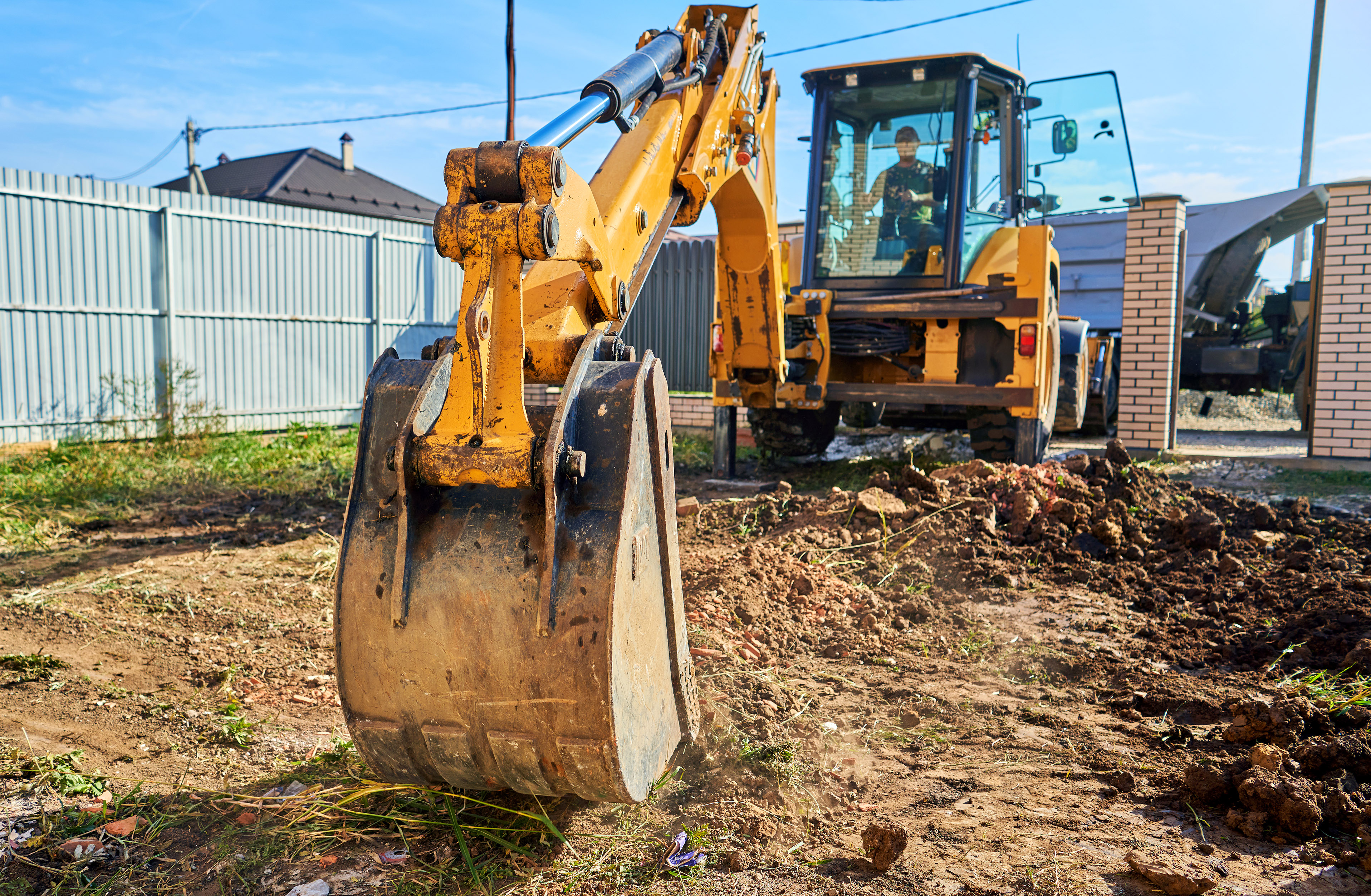 Banner Image - Get the Lead Out - Excavator Digging a Service - AdobeStock_384691445