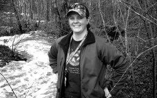 Halifax Water employee Kara, standing beside a river in the minicipality